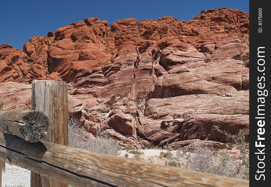 Dramatic Red Rock Canyon Landscape, wooden barricade in foreground. Dramatic Red Rock Canyon Landscape, wooden barricade in foreground.