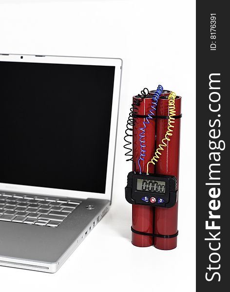 Laptop and red bomb over white background. Laptop and red bomb over white background