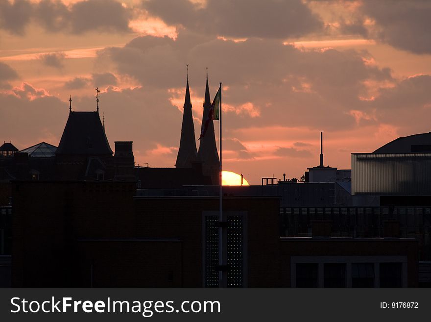 Sun setting over roofs of the Hague, the Netherlands. Sun setting over roofs of the Hague, the Netherlands