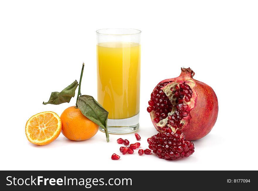 Tangerines and pomegranate on a white background