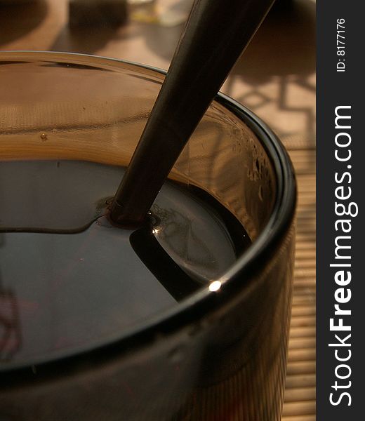 Hot black tea in a transparent glass cup