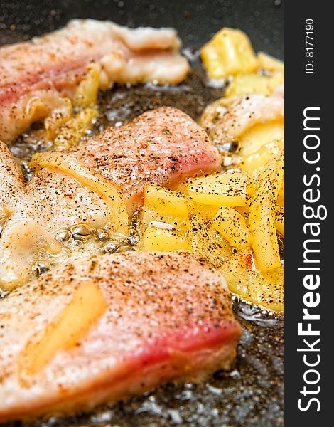 Pangasius filet frying with yellow peppers. Pangasius filet frying with yellow peppers