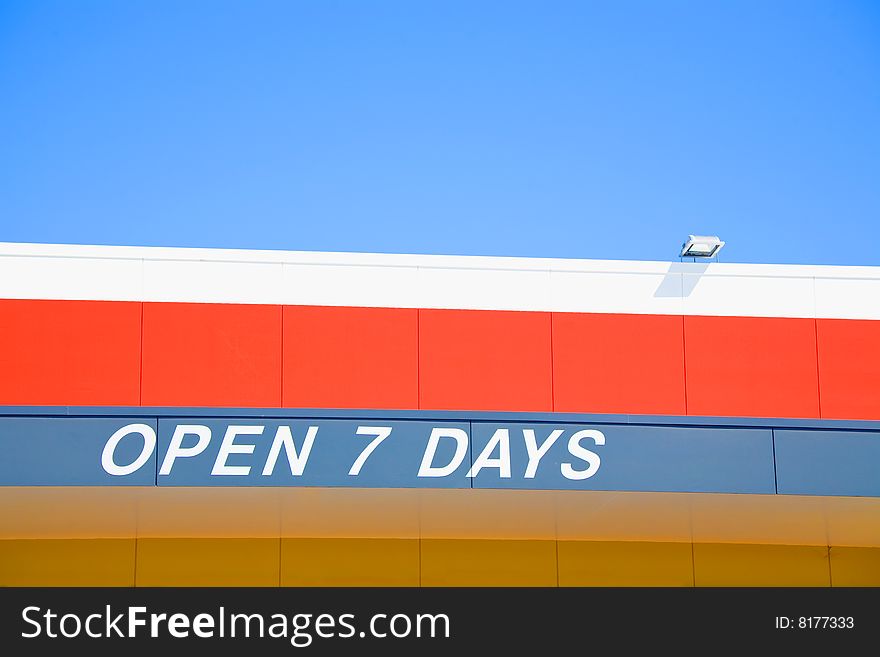 Open 7 days sign on roof of business