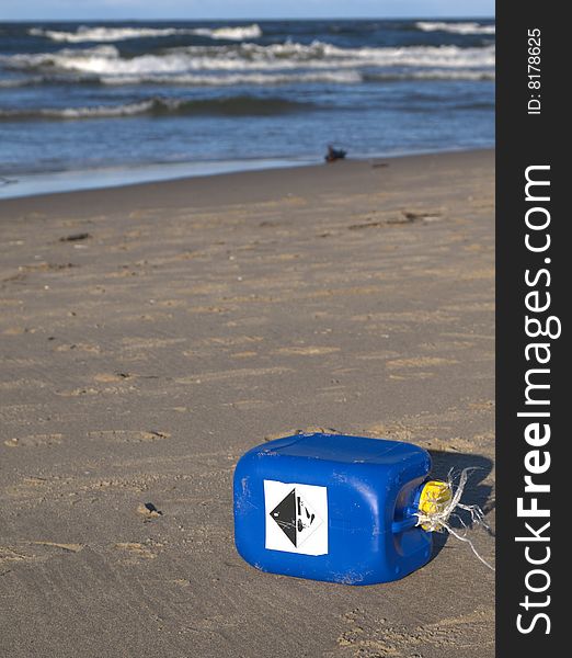 Chemical trash on beach - pollution concept. Chemical trash on beach - pollution concept