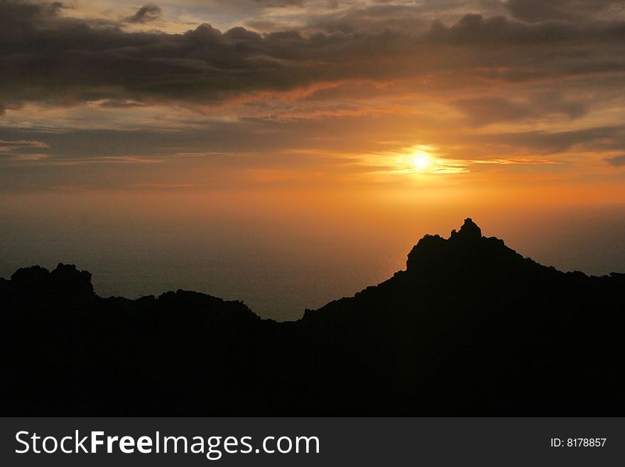 Sun down in ocean over vulcanic mountains of La Palma, Canaries Islands
