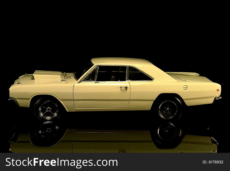 Side view of a Dodge Dart isolated on a black background. Side view of a Dodge Dart isolated on a black background