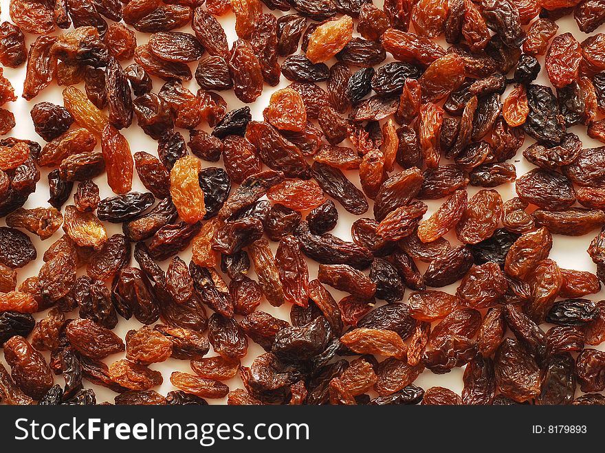 Many brown raisins background texture