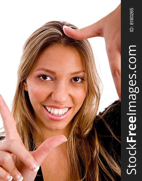 Woman biting her finger and looking sideways on an isolated background