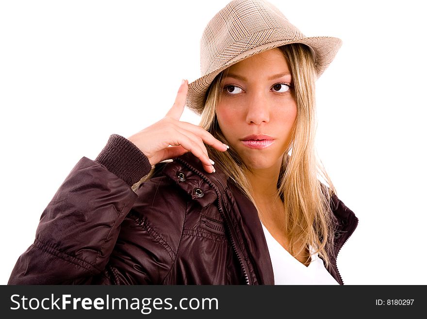 Woman biting her finger and looking sideways on an isolated background