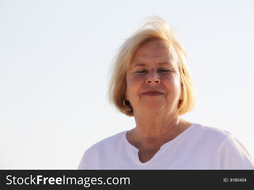 Photo of a happy senior on the beach. Photo of a happy senior on the beach