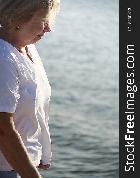 Photo of a happy senior on the beach. Photo of a happy senior on the beach