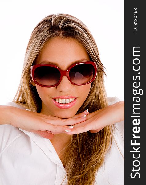 Woman biting her finger and looking sideways on an isolated background