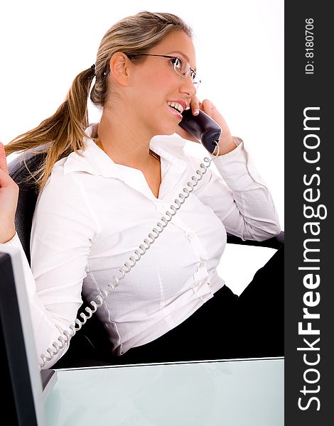 Side view of businesswoman talking on phone  in an office