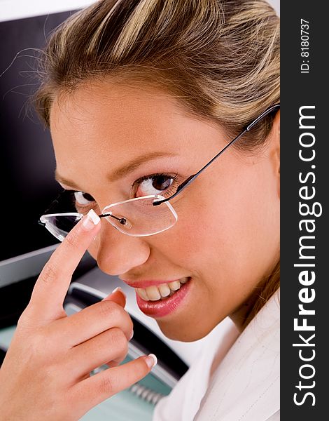 Close view of smiling professional looking at camera in an office