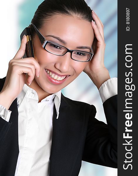 Businesswoman talks by a mobile phone. Please see some of my other business images:. Businesswoman talks by a mobile phone. Please see some of my other business images: