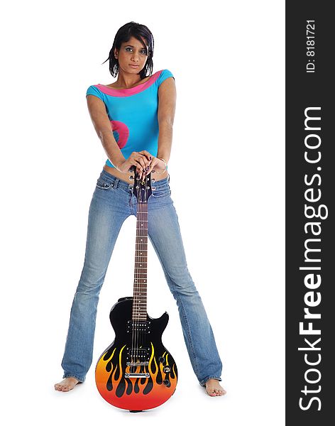Young girl holding guitar and looking seriously