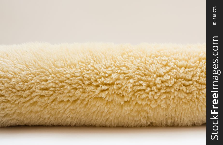The beige fur- sheep wool. The beige fur- sheep wool