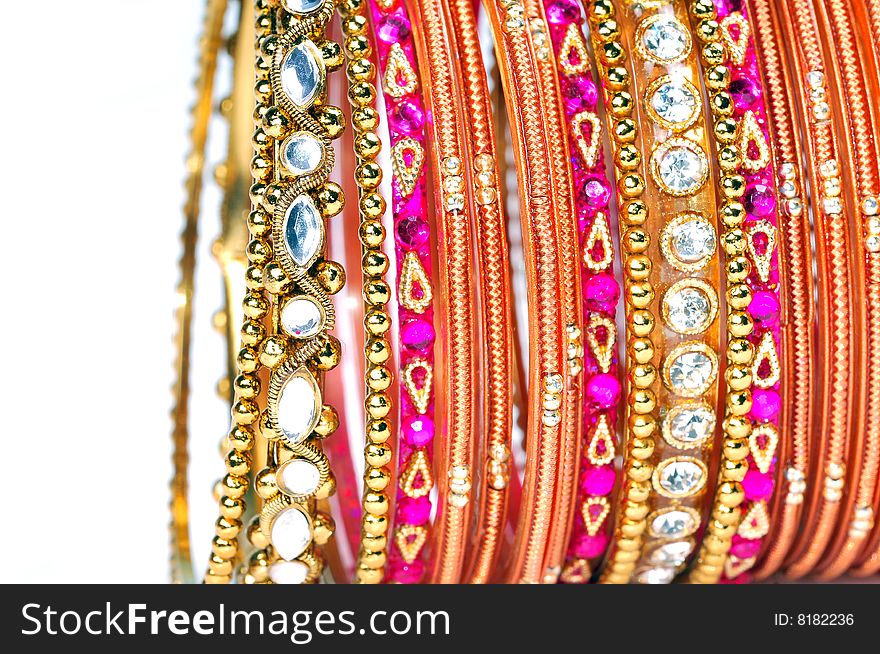 Golden bangles isolated on white background.