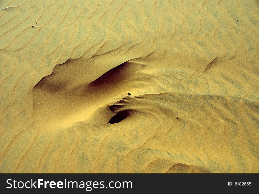 Wind pattern in the sand of dunes. Wind pattern in the sand of dunes