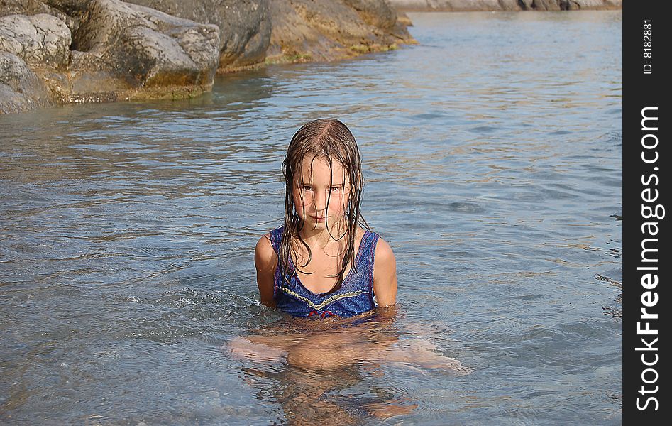 Portrait of girl siting in sea