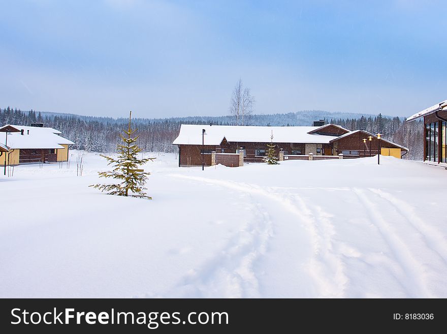 Winter landscape with cottages covered by snow. Winter landscape with cottages covered by snow.