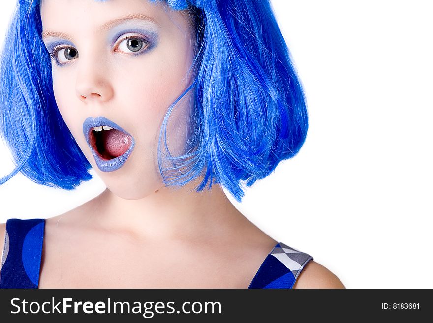 Young enthusiastic child with a blue wig shot on a white background. Young enthusiastic child with a blue wig shot on a white background