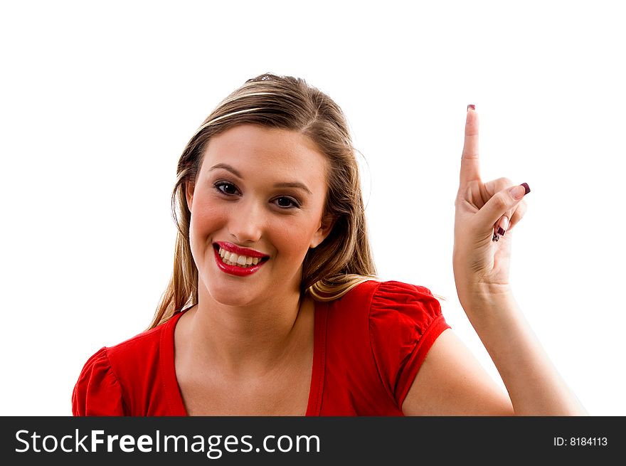 Woman biting her finger and looking sideways on an isolated background