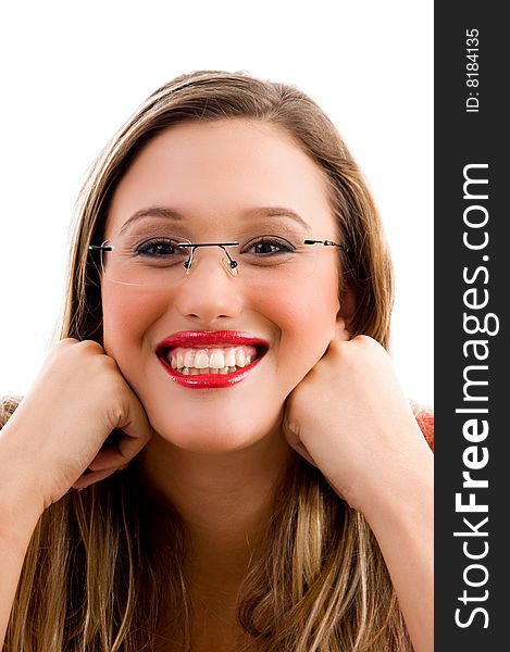 Woman biting her finger and looking sideways on an isolated background