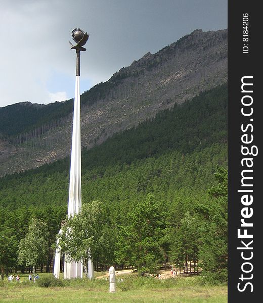 The monument of the eagle in the mountain covered by forest