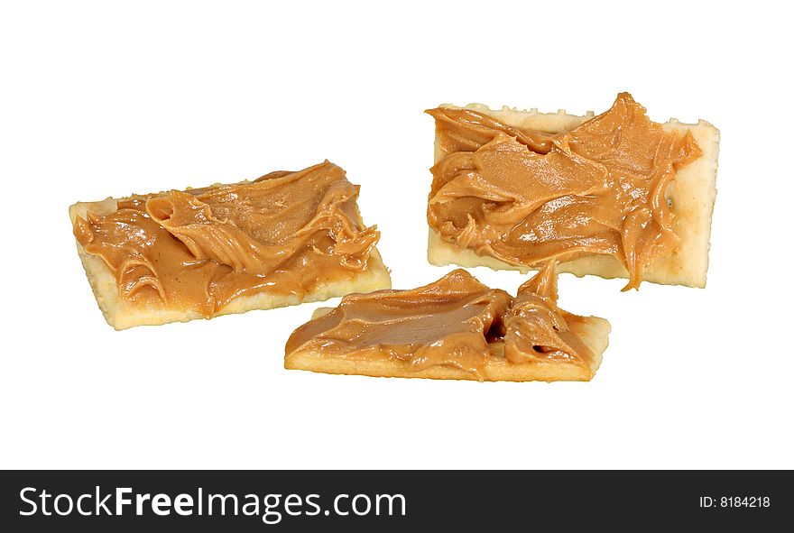 Three crackers with peanutbutter isolated on white. Three crackers with peanutbutter isolated on white