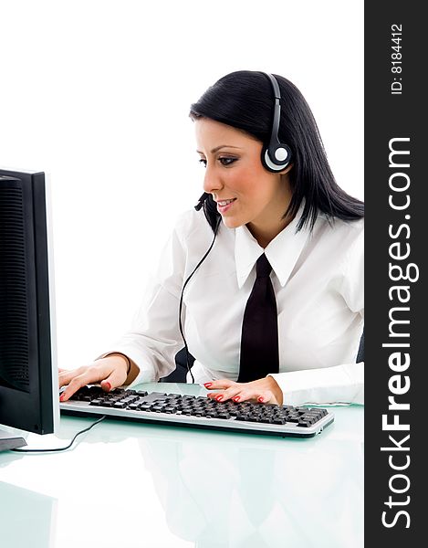 Young executive working on computer on an isolated white background