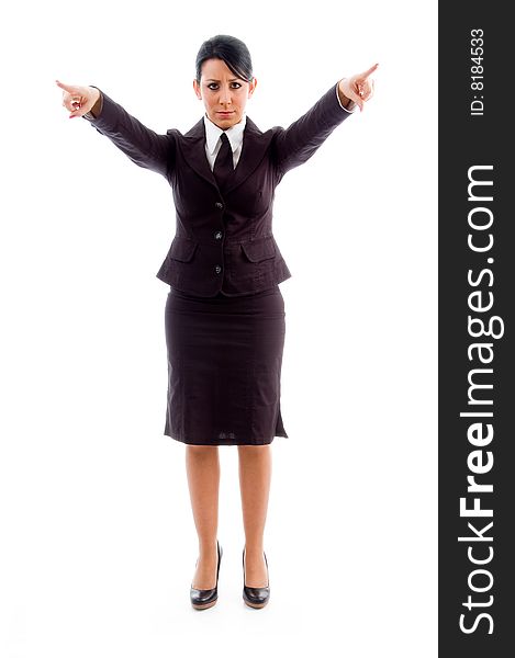 Young businesswoman pointing with both hands against white background