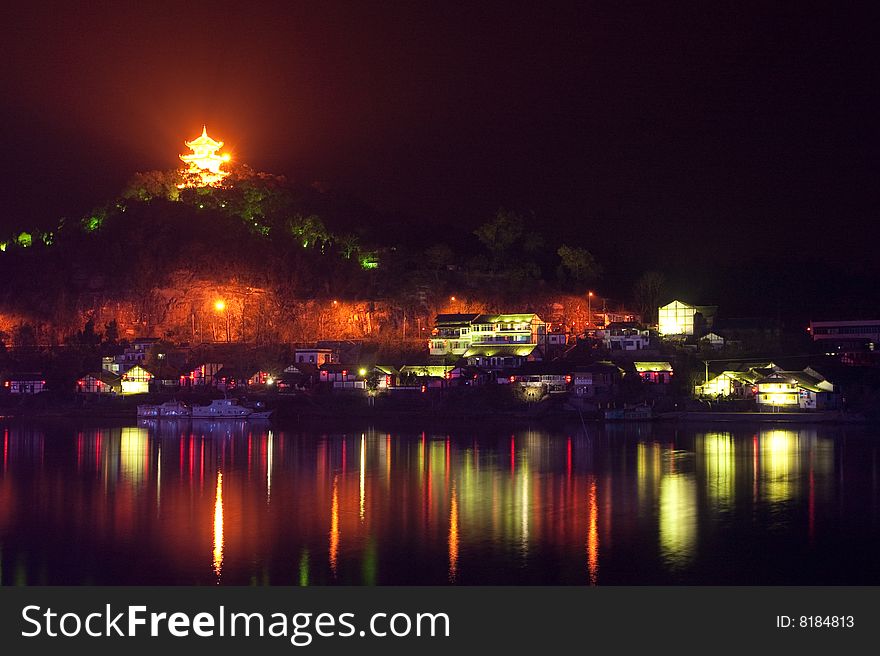 A village at night near a river in China. A village at night near a river in China.