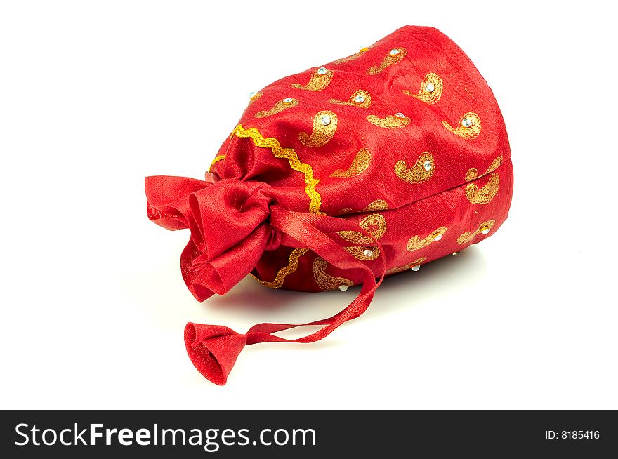 Red cloured gift pouch isolated on white