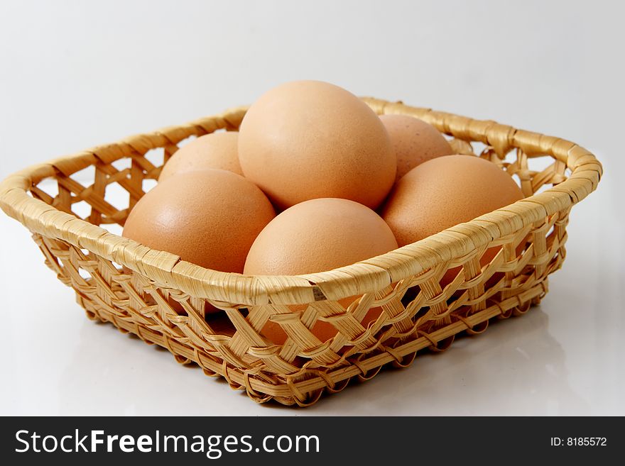 Fresh brown eggs in a basket. Fresh brown eggs in a basket