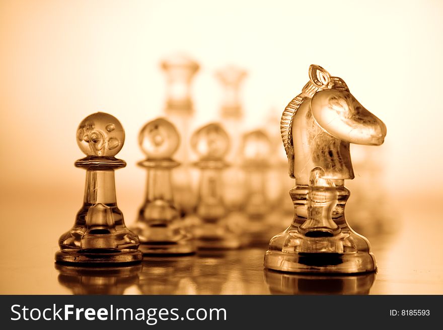 Transparent chess on a brown background