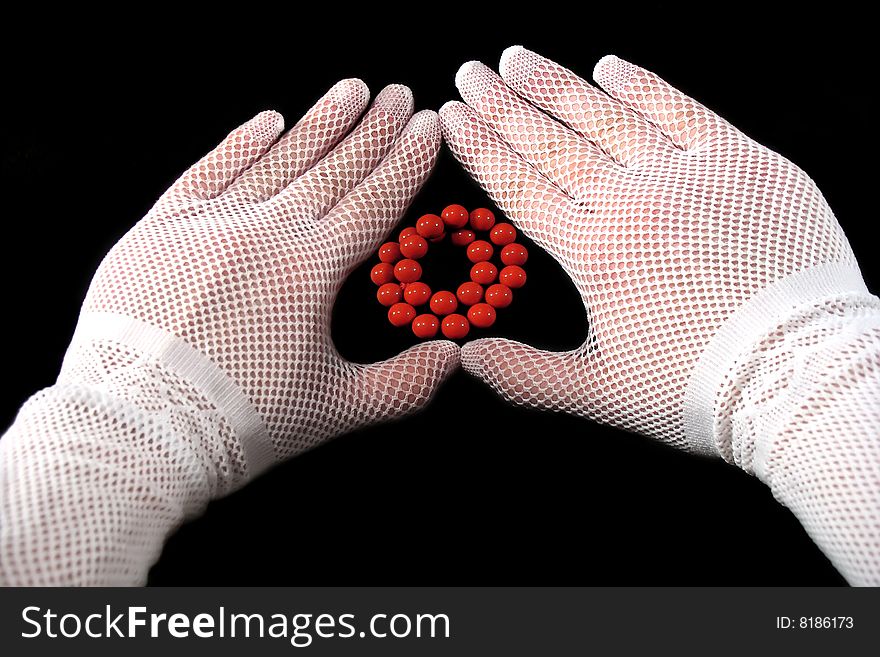 White-gloved hands make heart