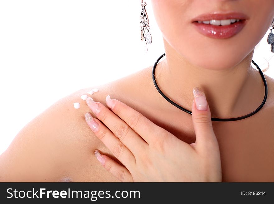 Yong girl with moisturizer isolated in white