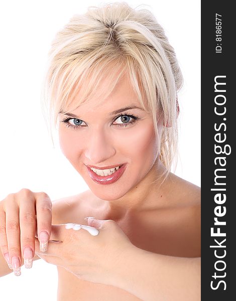 Lovely young blondie with moisturizer isolated in white. Lovely young blondie with moisturizer isolated in white