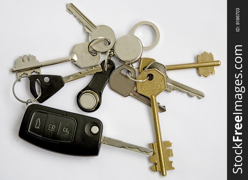 Keys from different doors and the car on a ring. Keys from different doors and the car on a ring