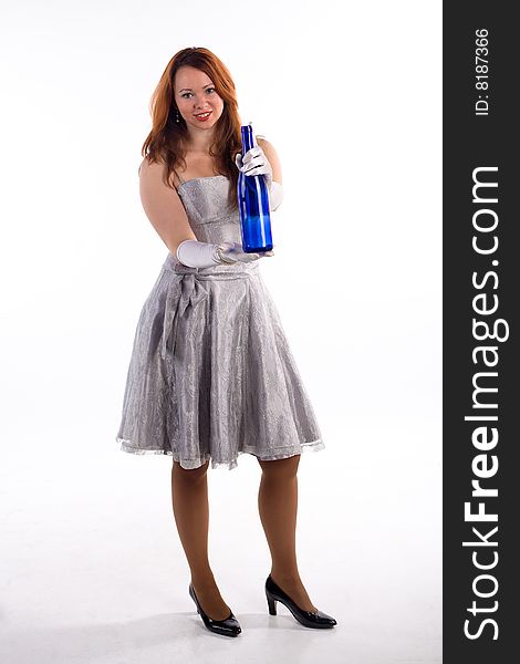 Young girl with white gloves and blue bottle standing on white background. Young girl with white gloves and blue bottle standing on white background