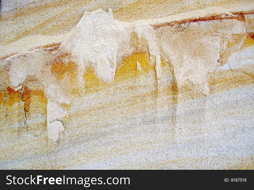 Sand background with yellow and reddish