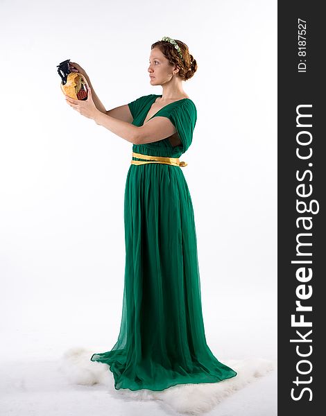 Lady in green antique dress handing jug on white background. Lady in green antique dress handing jug on white background