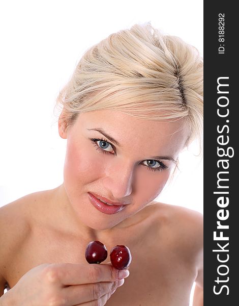 Lovely blondie with fresh cherry isolated on white. Lovely blondie with fresh cherry isolated on white