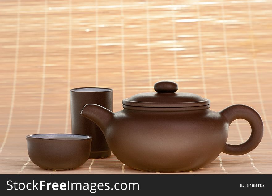 Brown chinese ceramic teapot with cups. Brown chinese ceramic teapot with cups