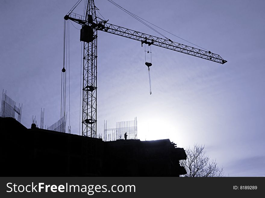 Сonstruction activity. Silhouette of construction worker