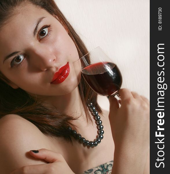 Portrait of the girl with a glass of wine. Portrait of the girl with a glass of wine.