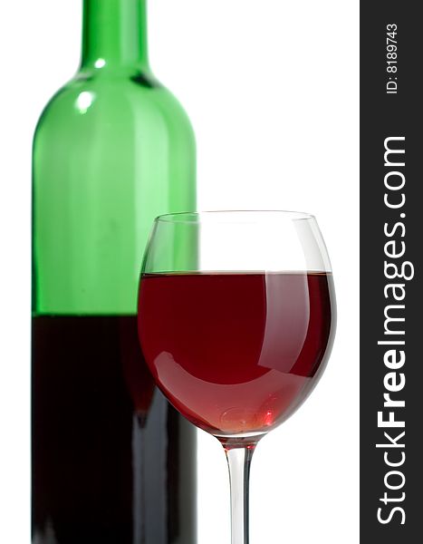 Bottle and glass of red wine on a white background