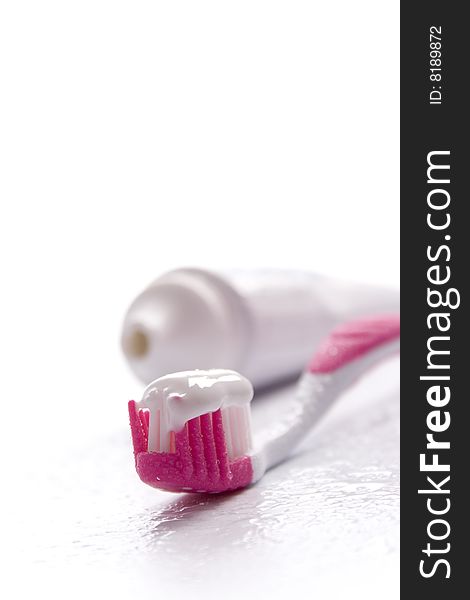 Toothpaste and toothbrush on white. dental care
