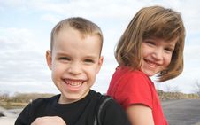 Two Children Smile For The Camera Royalty Free Stock Photos